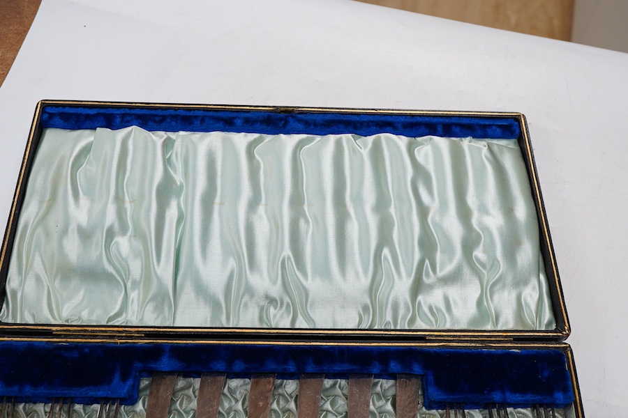 A cased set of six pairs of silver pistol handled dessert eaters, by James Dixon & Sons Ltd, Sheffield, 1905, knife 16.6cm.